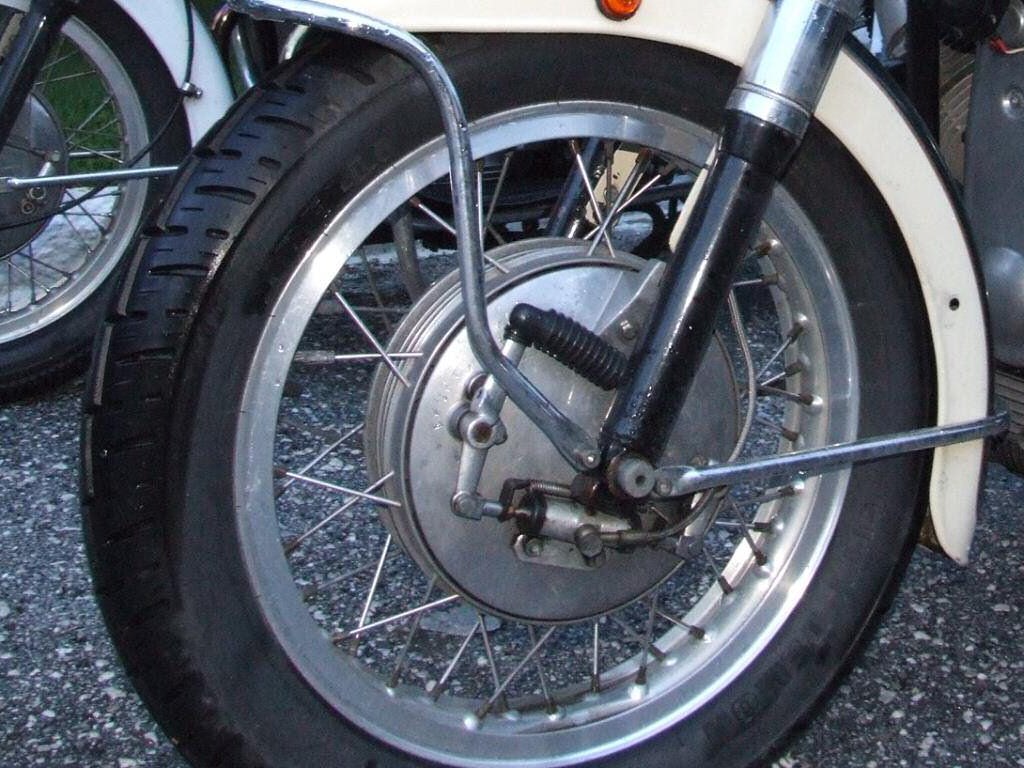 A hydraulic wheel cylinder operates the front front drum brake on a Moto Guzzi.
