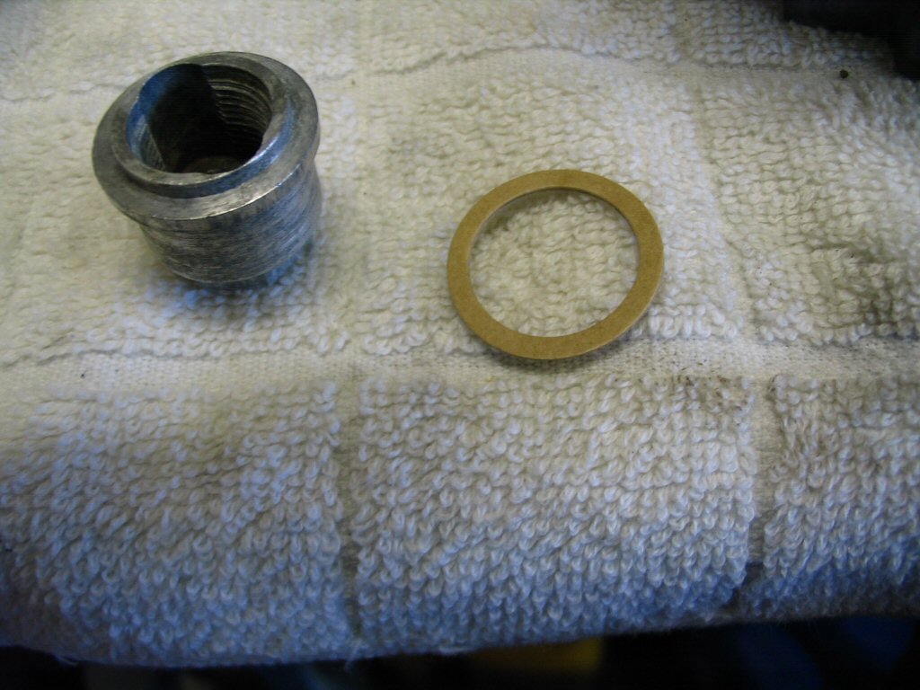 The float bowl nut and gasket.