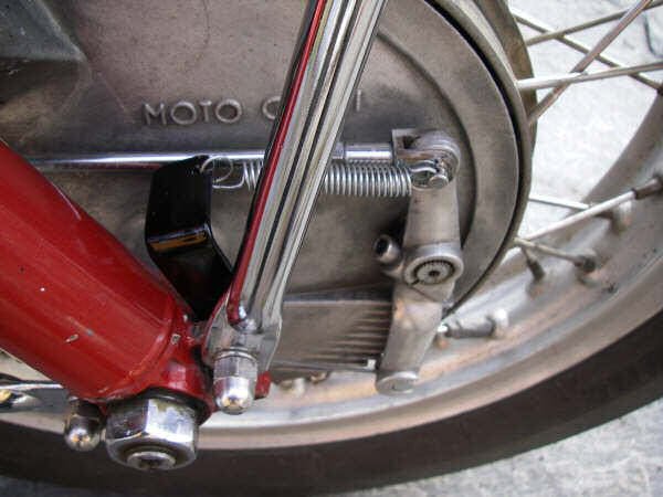 External brake return spring fitted to a 4-leading shoe drum brake as found on some Moto Guzzi 850 GT, 850 GT California, Eldorado, and 850 California Police motorcycles.