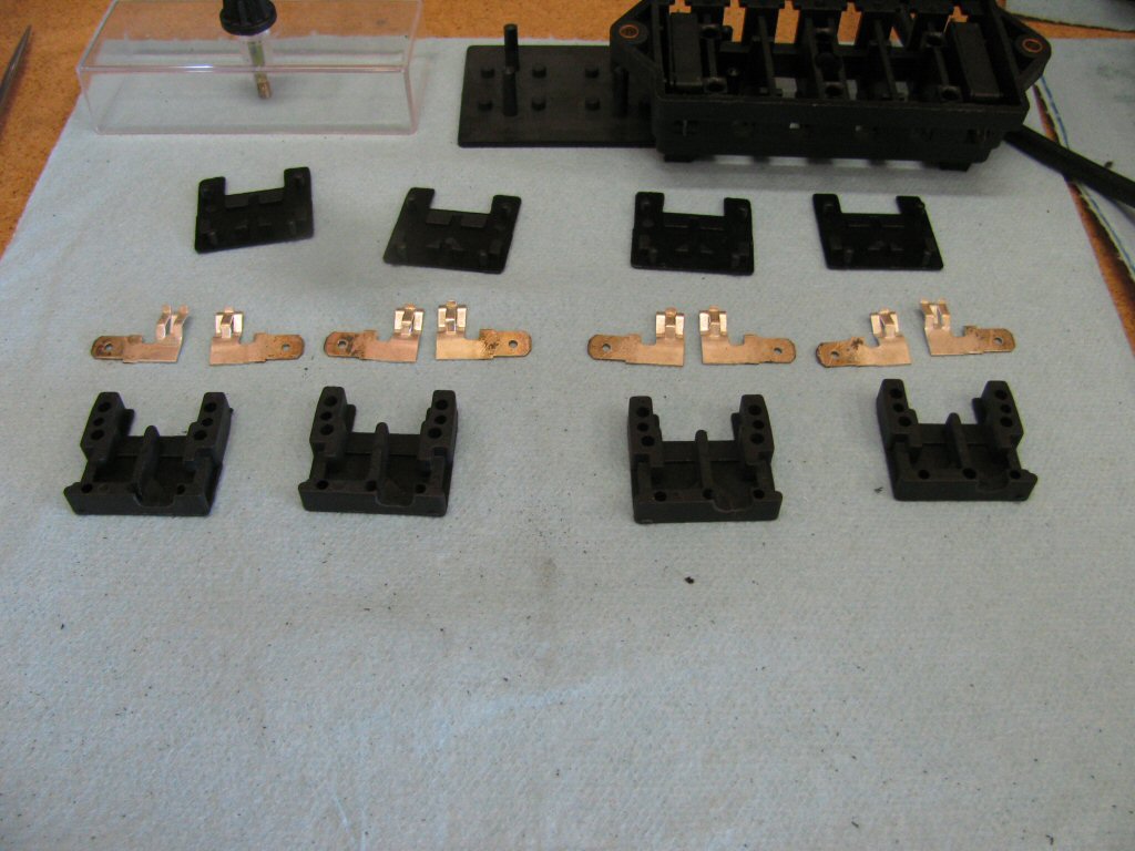 Here are four fuse holders with the material removed for the terminals.