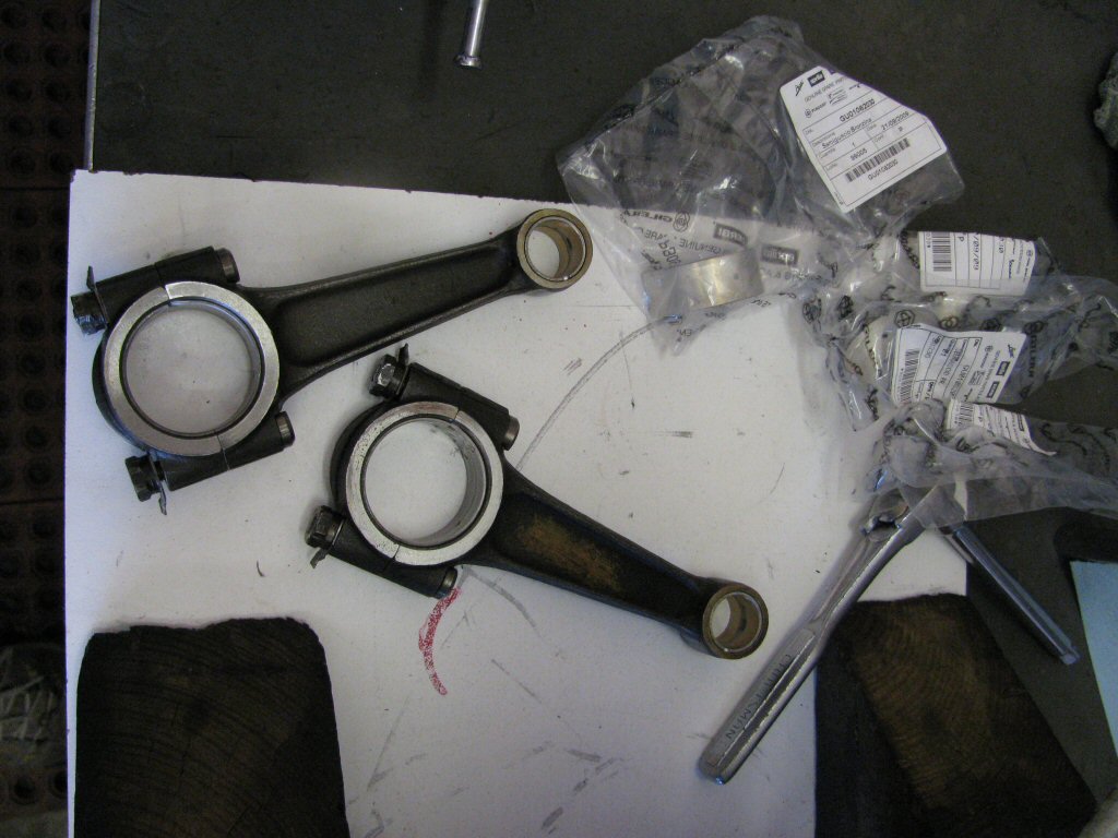 Connecting rods and plastic bags containing the new shells.
