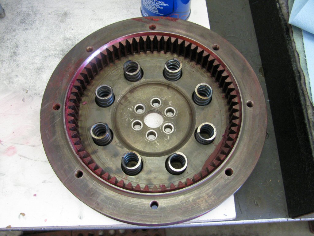 Flywheel with new springs. Red color is from layout dye that was used when diagnosing engine/transmission misalignment.
