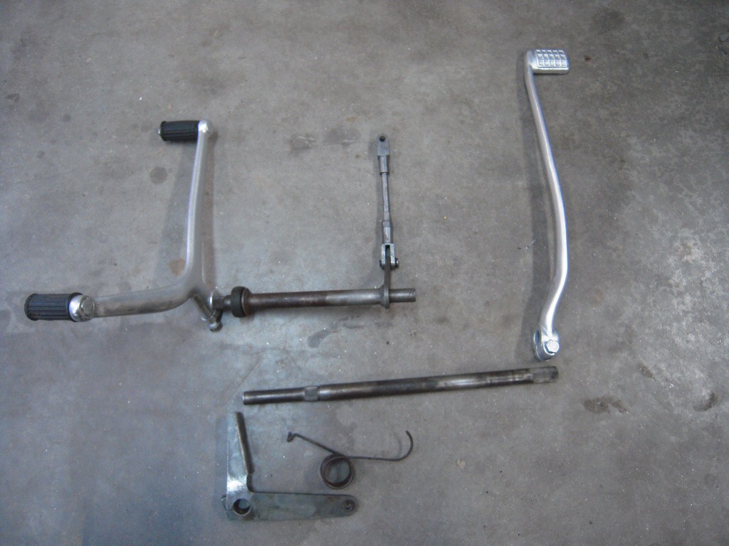 Factory kit for converting a V700 to have left side shift/right side brake.