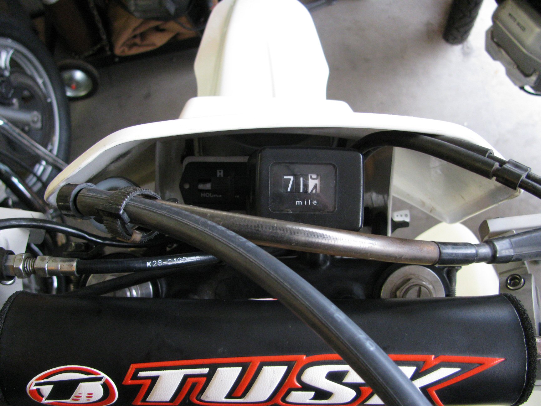 Pro Power Hour Meter installed on a 1993 Suzuki DR350 dirt motorcycle.