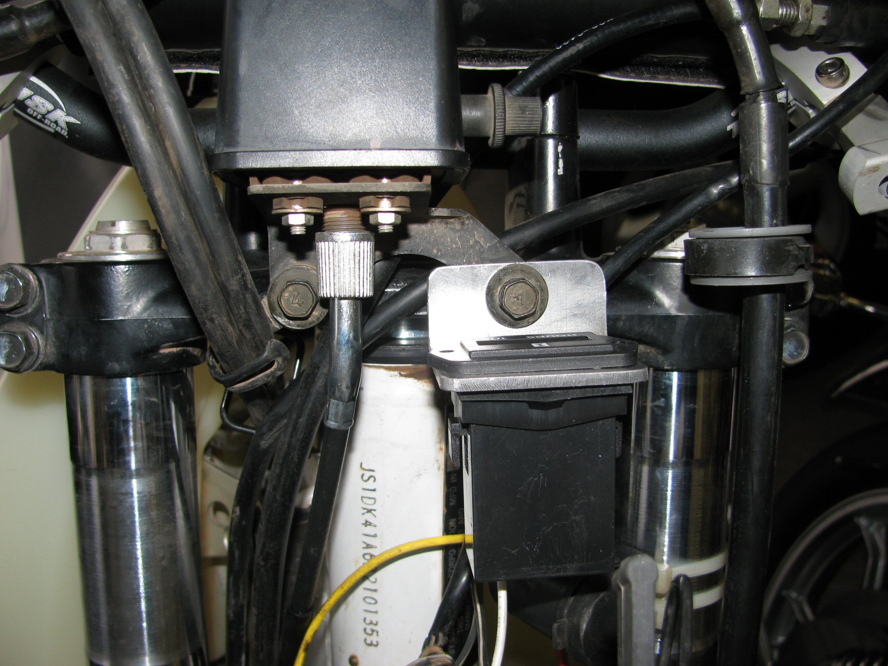 Pro Power Hour Meter installed on a 1993 Suzuki DR350 dirt motorcycle.