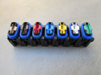 Fuse holders may be ganged together to form a bank of fuses.