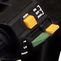 A left side paddle type switch (there are at least a couple of variations). Switch not inclucded.