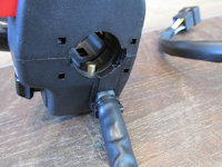 Domino left handlebar switch: right side view with anti-rotation pin.