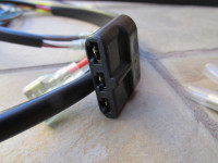 Flat 3 terminal connection for the voltage rectifier. The flat connector pictured is no longer available. You may reuse your original connector, or fit the individual insulators provided.