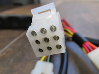 9 terminal connection to the left handlebar switch at the mounting plate beneath the dash.