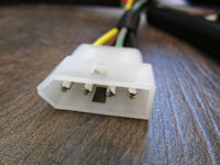 4 terminal connection that connects to the harness that plugs into the rear of the headlight bucket (free hanging).