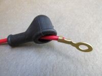 Rubber boot/cover shown in use with a 12 AWG wire and a 6 mm ring terminal. (MG# 12702900).