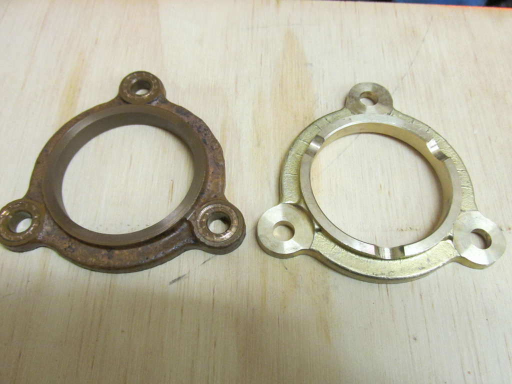 Cam thrust plate. Original on left, new on the right. The original shows considerable wear on the front side.