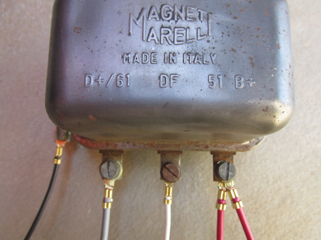 Original Magneti Marelli mechanical voltage regulator.