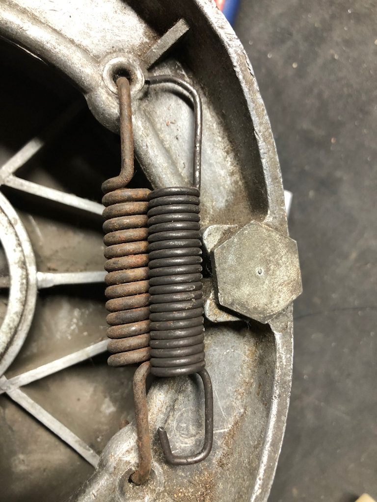 Old 3 mm spring in situ on left; modified 2 mm spring from a wrecker on right - the arms were shortened and re-bent ... and gave years of good service.