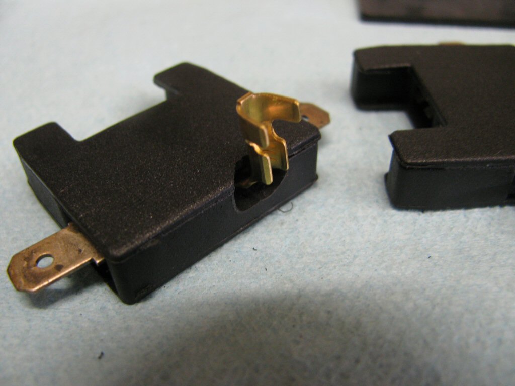 A close up view of the modified fuse holder and cover.