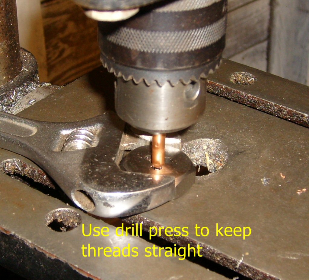 Use drill press to keep threads straight.