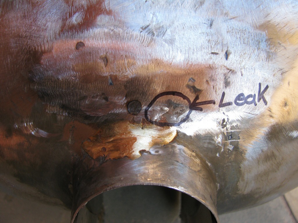 Dent pulled from top front of tank, ready for filler. Leak at this location was not identified until later.