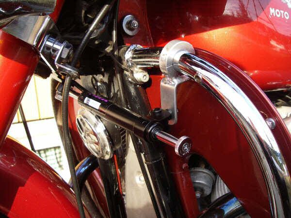 Joe Jump's steering damper kit fit to Frank Granli's motorcycle with leg shields.