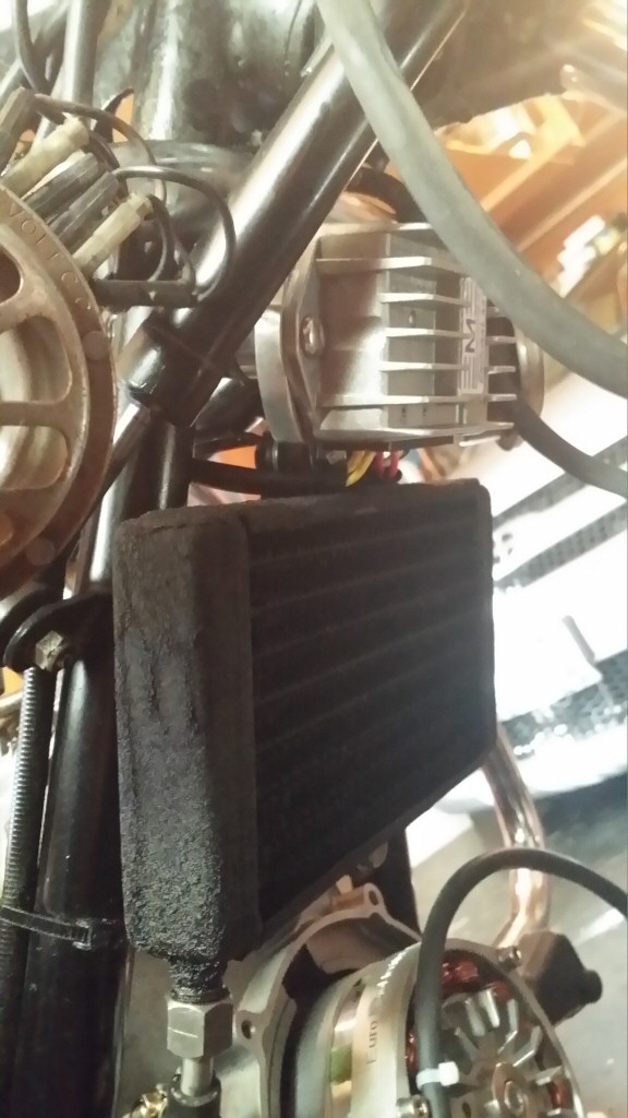 Voltage regulator/rectifier in place above original oil cooler on a Moto Guzzi V1000 I-Convert.